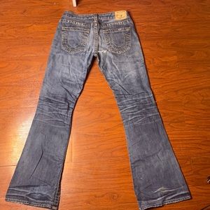 True Religion bootcut jeans with rips and patches